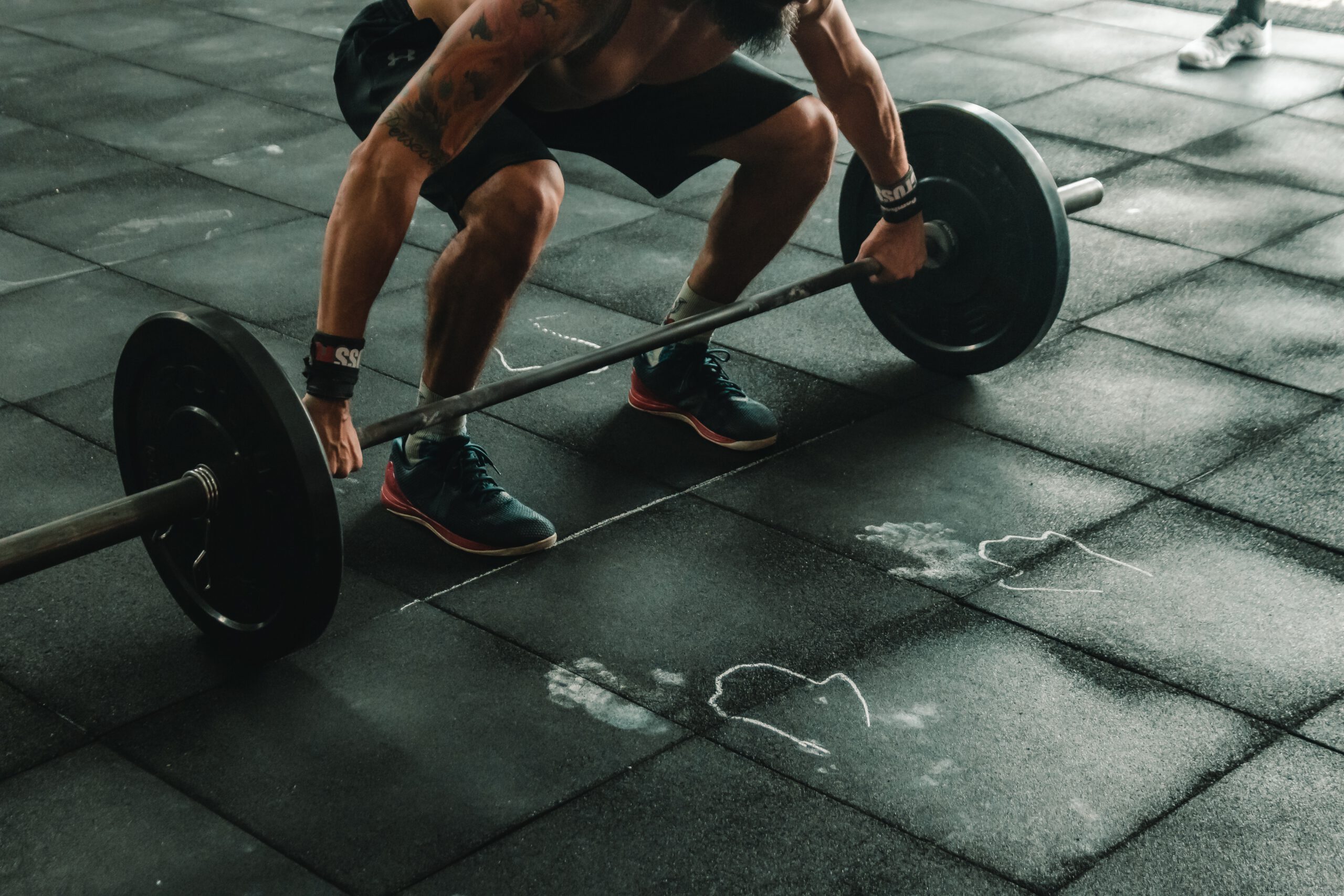 Man doing some weightlifting.                                                                                                                          