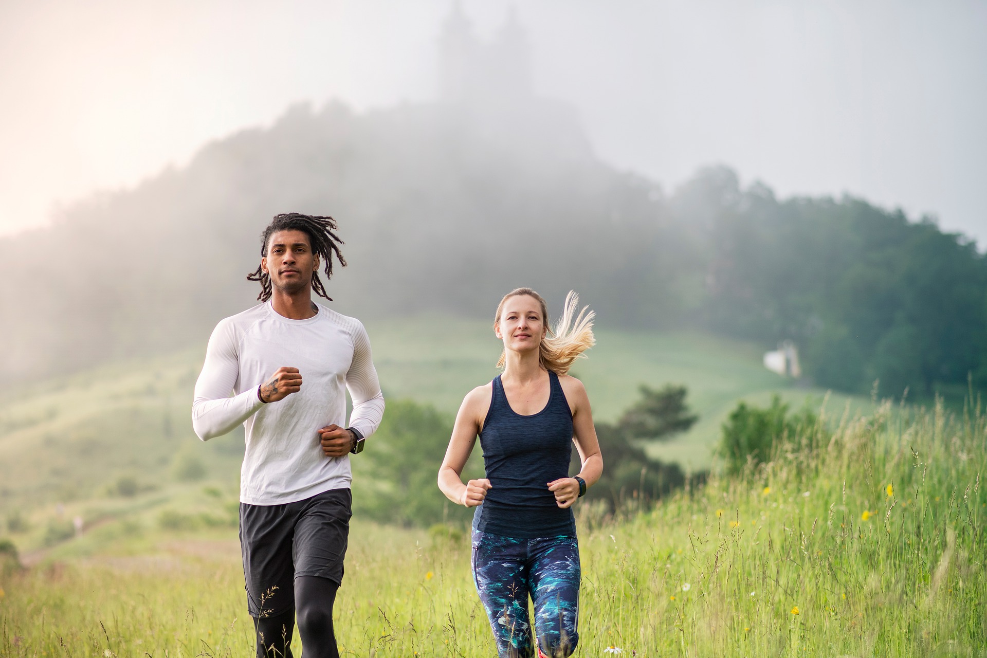 A man and a woman doing cardio wearing eco-friendly clothes.