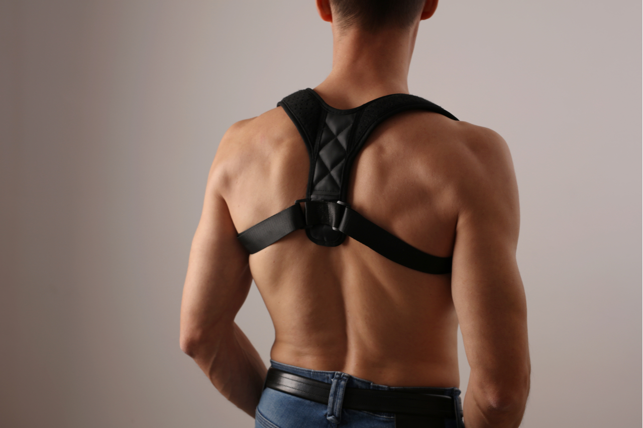 Man with posture corrector.