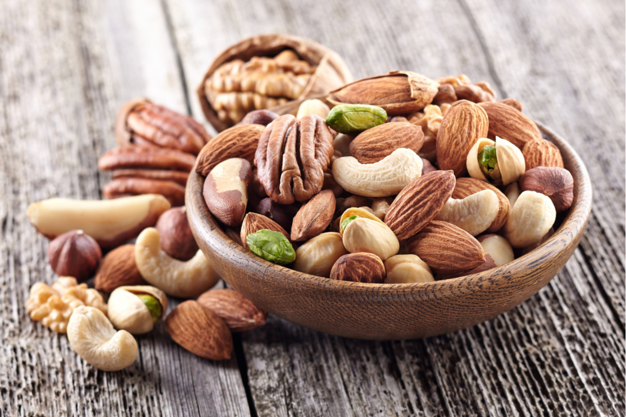 Mixed nuts in a wooden bowl.