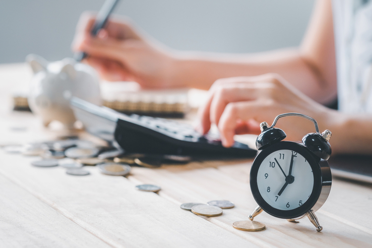 Woman checking lower interest rates to save time and money.