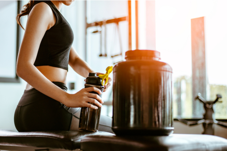 woman taking creatine supplement