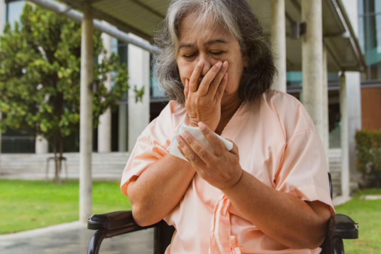 Elderly asian woman sitting wheelchair and hospital patient suffering