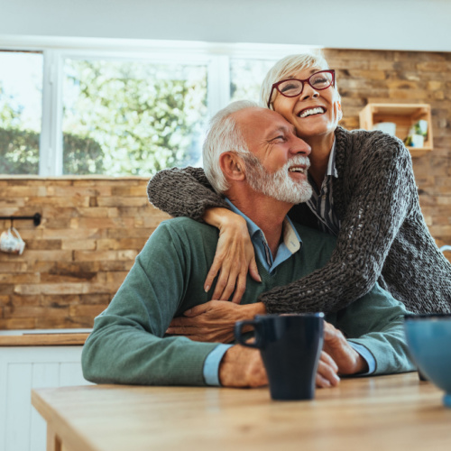 Grandparents hugging each other