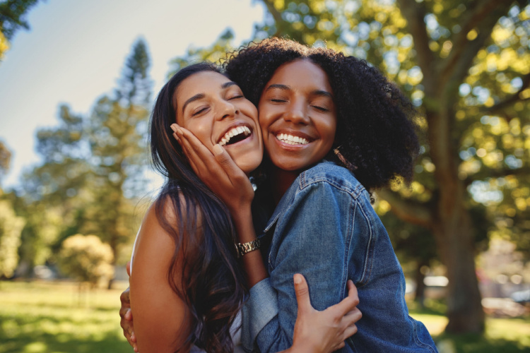 happy best friends hugging each other